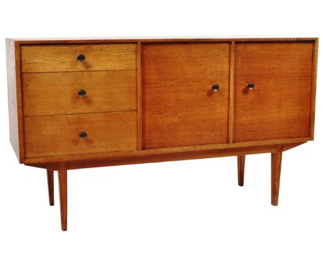 A retro vintage mid 20th Century light golden oak sideboard credenza of smaller proportions in the manner of Gordon Russell c