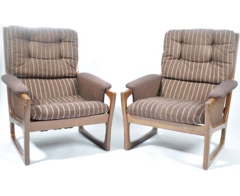Folke Ohlsson - Gimson &amp; Slater - A pair of original vintage 1960's teak framed armchairs / arm chairs having a slatted b