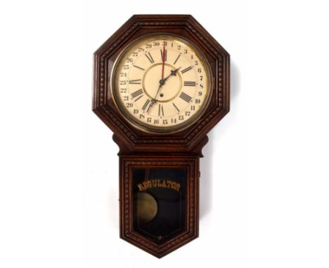 Late 19th/early 20th century American wall mounted timepiece with calendar, carved and moulded octagonal surround over a glaz