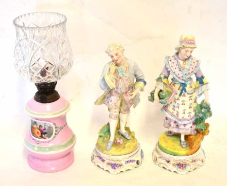 Pair of European porcelain large figures of dandy and a female flower seller, each painted in colours, circa late 19th centur