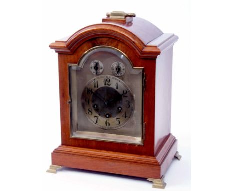 Early 20th century walnut cased triple spring barrel bracket clock, Junghans, the arched case with overhanging cornice surmou