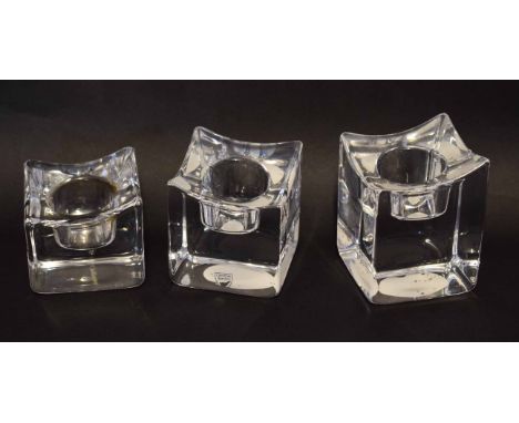 Boxed set of three Orrefors glass candle holders, 10cm high, the holders with etched Orrefors factory mark in original box (3