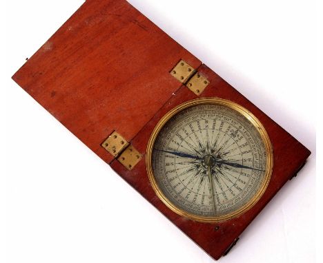 19th century mahogany cased compass of hinged and square form with fluted inset bezel and glazed panel to a paper scale and w