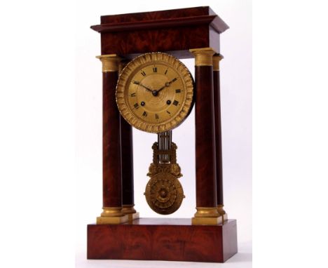 19th century French mahogany and gilt metal mounted portico clock, the plinth shaped pediment with overhanging cornice suppor