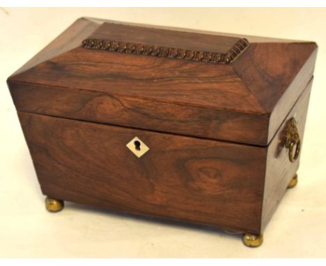 Early 19th century rosewood tea caddy, ogee top, interior fitted with two compartments, applied at either end with lion mask 