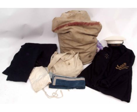 Mid-20th century Royal Naval kitbag and contents comprising a white Naval cap with band to HMS Tiger together with two woolle