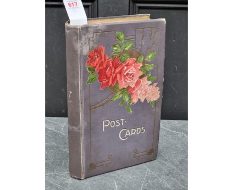 POSTCARDS:&nbsp;a vintage album of cards, grey cloth covers with floral design to upper board. (Album)