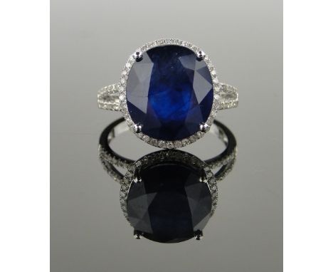 14ct white gold sapphire and diamond cluster ring,
sapphire approx. 8.3cts, diamond content approx. 0.5cts, size N, setting h