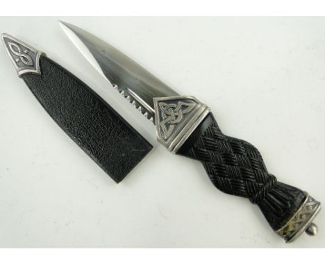 A modern Scottish Skean Dhu and scabbard,
length 7.5".