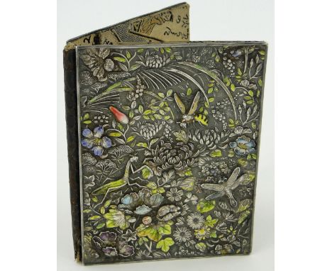 A Chinese unmarked silver and coloured enamel card case circa 1900,
the relief decorated covers depicting insects and flowers