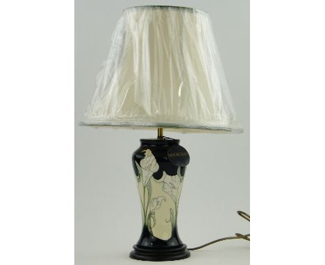 A modern Moorcroft pottery table lamp,
with tube-lined floral designs and new shade, height incl. shade 23".