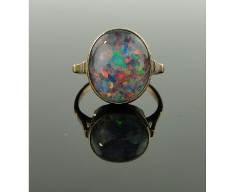 A 9ct gold opal ring,
setting height 14mm, size L.