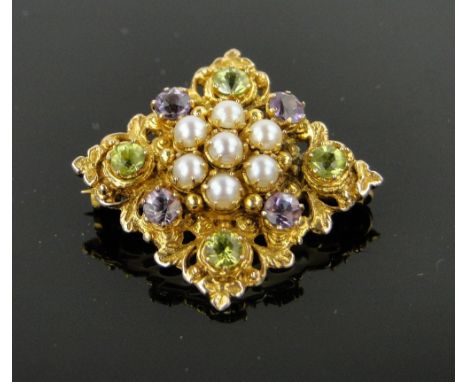 9ct gold brooch,
with a central cluster of pearls surrounded by amethyst and peridots, width 32mm.