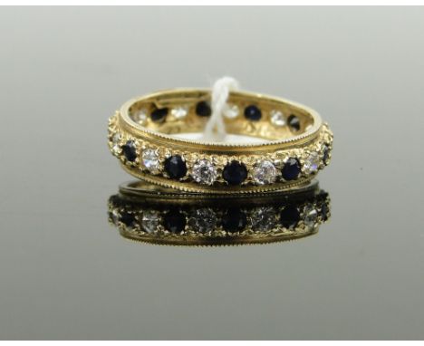 A 9ct gold sapphire and diamond set eternity ring, 
size P.