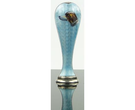 A silver and enamel desk seal,
with painted design of a dog's head, marked 925 AJ, height 7cm.