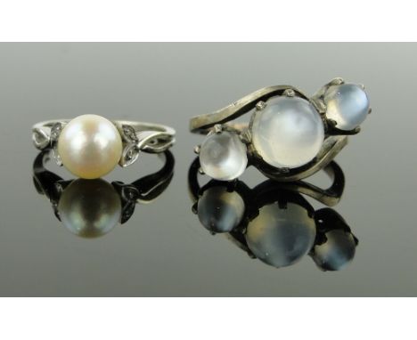 18ct white gold pearl ring with diamond shoulders,
and a silver moonstone set ring, (2).