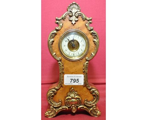 A late 19th century walnut cased balloon mantel clock of small size,
with ormolu mounts, height 8.5".