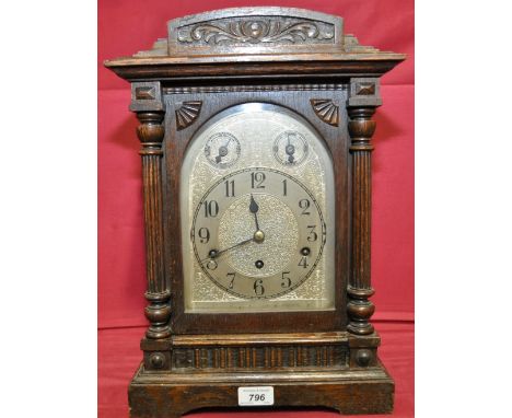 An early 20th century oak cased mantel clock,
with 3-train movement and silver dial, height 17".