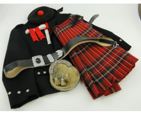 A Highland Piper's uniform,
comprising jacket, kilt, sash and belt.