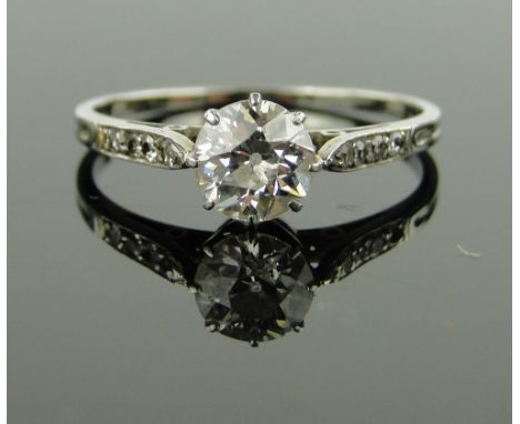 18ct white gold solitaire diamond ring,
with small diamond set shoulders approx. 0.6cts, size N.