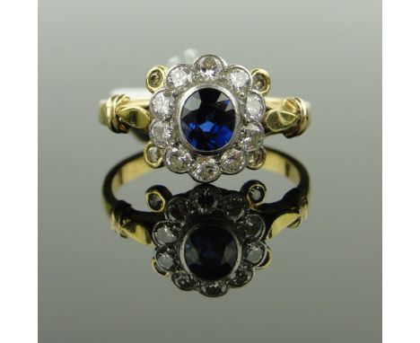 18ct gold and platinum sapphire and diamond cluster ring,
setting height 12mm, size S.