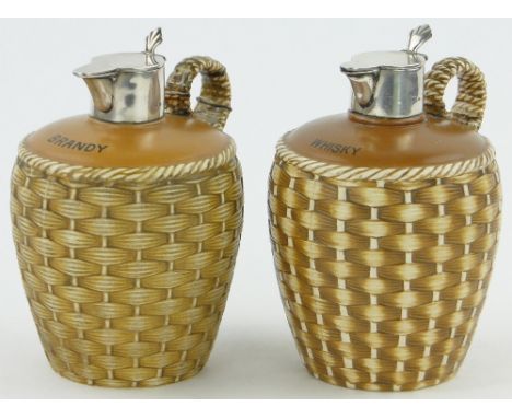 Pair of Victorian ceramic whisky and brandy flagons,
with hinged silver tops, height 6".