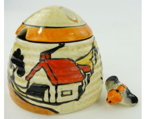 Clarice Cliff "Fantasque" honeypot and cover,
with house in landscape design, height 3.25" overall.