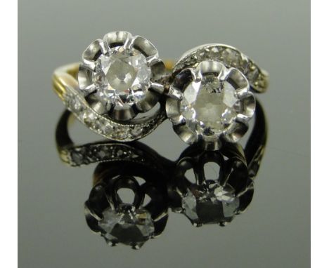 18ct gold and platinum 2 stone diamond crossover ring,
with diamond set shoulders, diamonds approx. 5mm across each, size O.