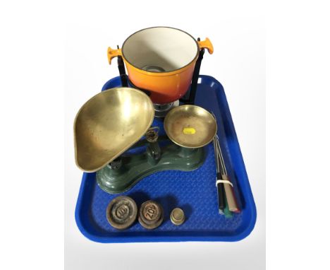 A Le Creuset enamelled cast-iron cooking pot on burner stand, together with a set of scales and weights, and a bundle of fork