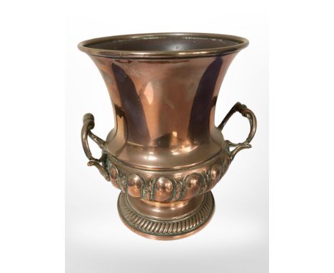 A 19th-century copper planter in the form of an urn, height 21cm.