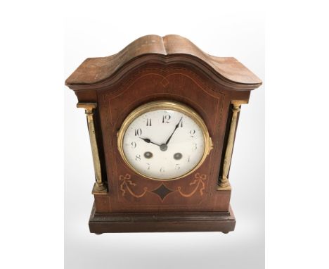 An Edwardian inlaid mahogany eight-day mantel clock, height 27cm.