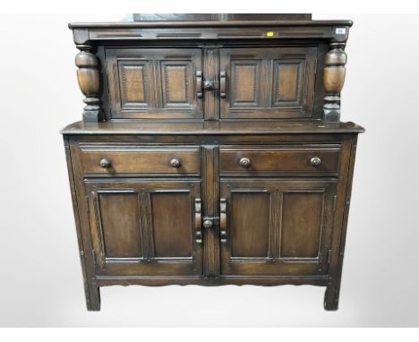An Ercol stained elm sideboard, 123cm w x 47 d x 124 h. 