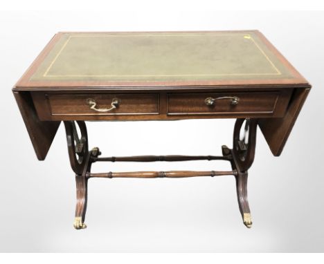 A reproduction mahogany drop leaf sofa table in the Regency style, width 90 cm un-extended 