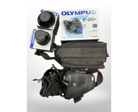 An Olympus Camedia E-20P with Olympus Lens AF Zoom 62mm, comes with battery charger, power battery holder, tele extension len