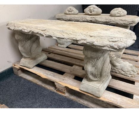 A concrete rustic garden bench on squirrel supports, width 100cm. 