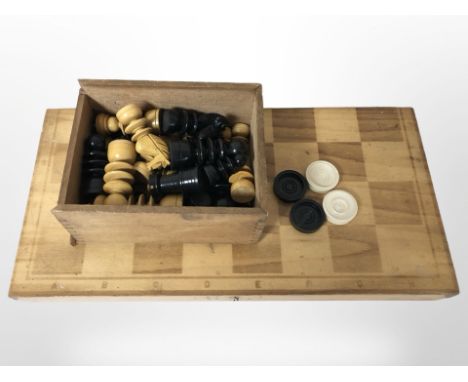 A wooden folding chessboard and a set of turned and stained boxwood pieces, quantity of checkers.