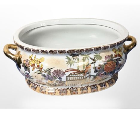 A contemporary oriental porcelain twin-handled planter, width 58cm.