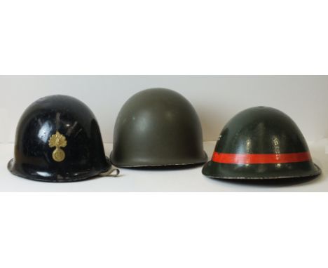 A French metal infantry helmet with R F grenade motif, and two other metal helmets, (3).