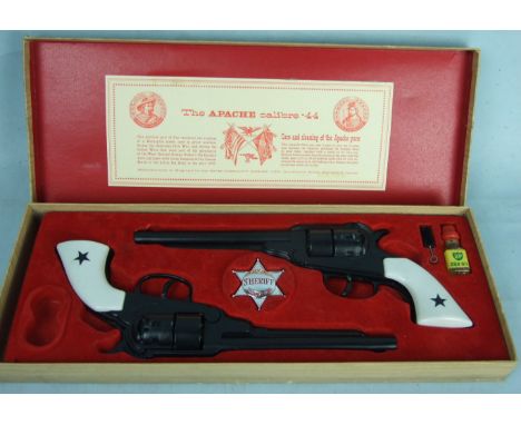 B. M. C. Company (Derby) Ltd Outlaw Gun Set 'The Apache calibre .44', consisting of two diecast, plastic-handled guns, a City