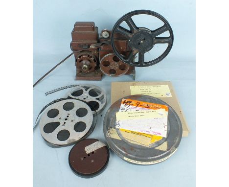 An unmarked 9.5 Cine projector and five film reels, all marked for Mickey Mouse (untested).