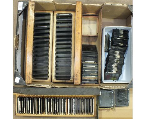 Approximately 300 magic lantern slides, including some in colour: mainly topographical and some children's story slides in wo