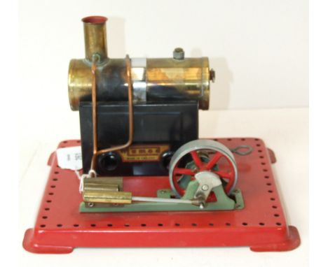 Mamod, a horizontal stationary steam engine with burner.