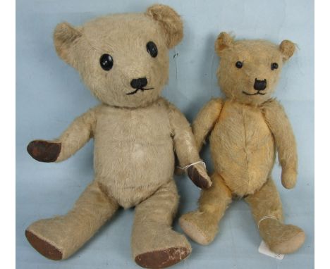 A Chiltern Hugmee-type teddy bear with blonde mohair, replaced boot button eyes, stitched nose and mouth, inoperative growler