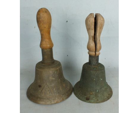 Two hand bells, one with cast-in military arrow, both with turned handles (af).