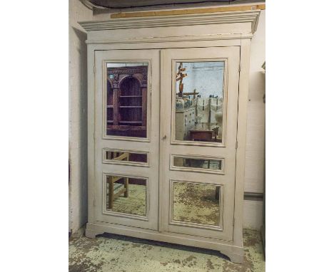 ARMOIRE, Continental grey painted with a pair of mirrored doors enclosing a shelf and hanging rail, 172cm x 224cm H x 67cm.