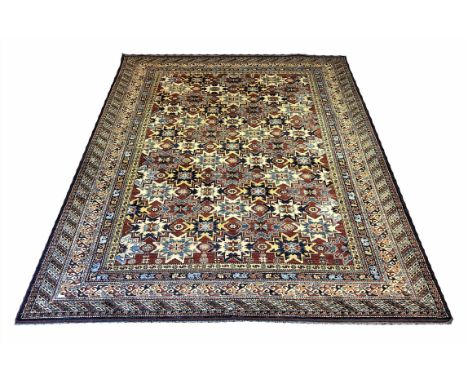 FINE KAZAK CARPET, 343cm x 267cm, all over star medallion design within corresponding bands and borders.