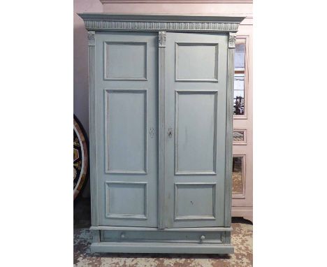 ARMOIRE, 19th century continental turquoise painted with carved detail and a pair of panelled doors enclosing a hanging rail,