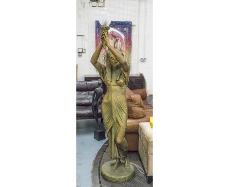 FIGURAL LAMP, gilded in the form of an Egyptian maiden with flambeau glass shade, 190cm H.