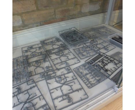 A collection of 17 Lord of the Rings Sprues - not all complete - and ladders, siege shields