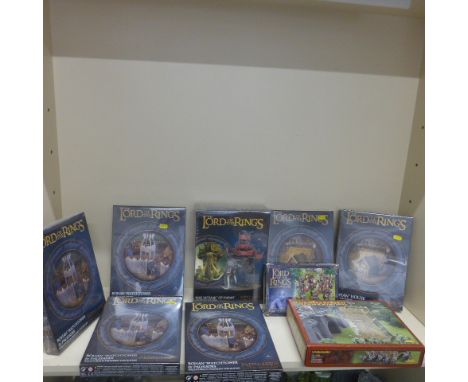 Games Workshop Lord of the Rings 4 Rohan Watchtower kits, 2 Rohan houses, a War Mumak of Harad kit, a siege tower and Khaudis